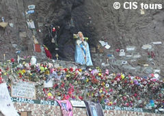 Virgin of Lourdes and offerings