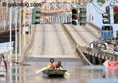 Victims of the Katrina in New Orleans try to live through the floods